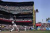 San Francisco Giants' LaMonte Wade Jr. hits an RBI-single against the Milwaukee Brewers during the second inning of a baseball game in San Francisco, Sunday, May 7, 2023. (AP Photo/Jeff Chiu)