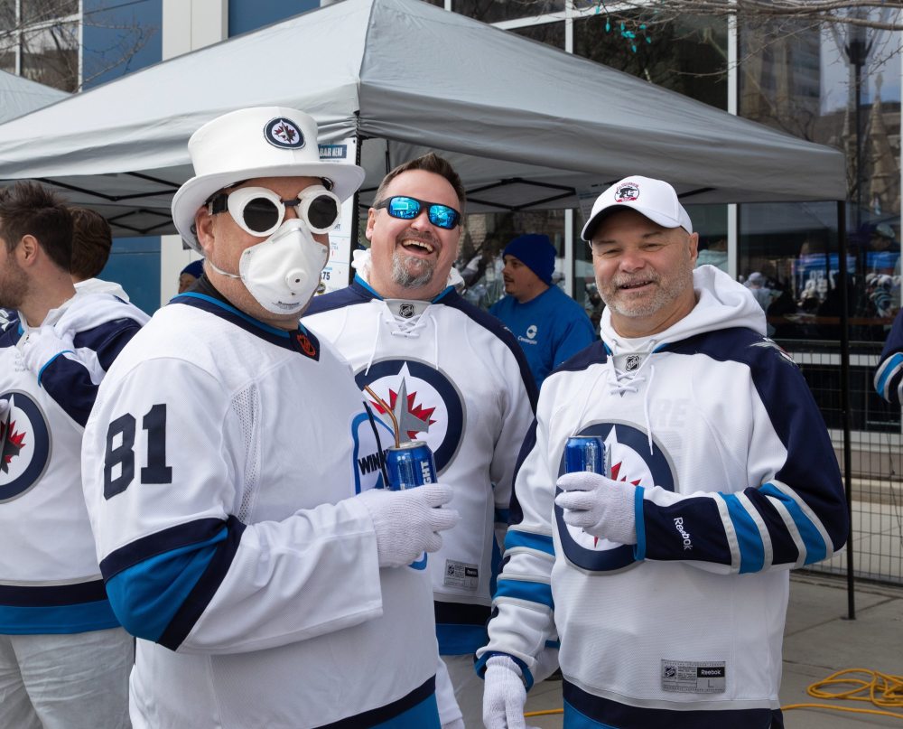 JESSICA LEE / WINNIPEG FREE PRESS
Ken Tallaire (left) is photographed with friends at a Whiteout party. Thousands of Winnipeg Jets fans gathered downtown beside Canada Life Centre April 22, 2023 to watch the Jets play against the Golden Knights.