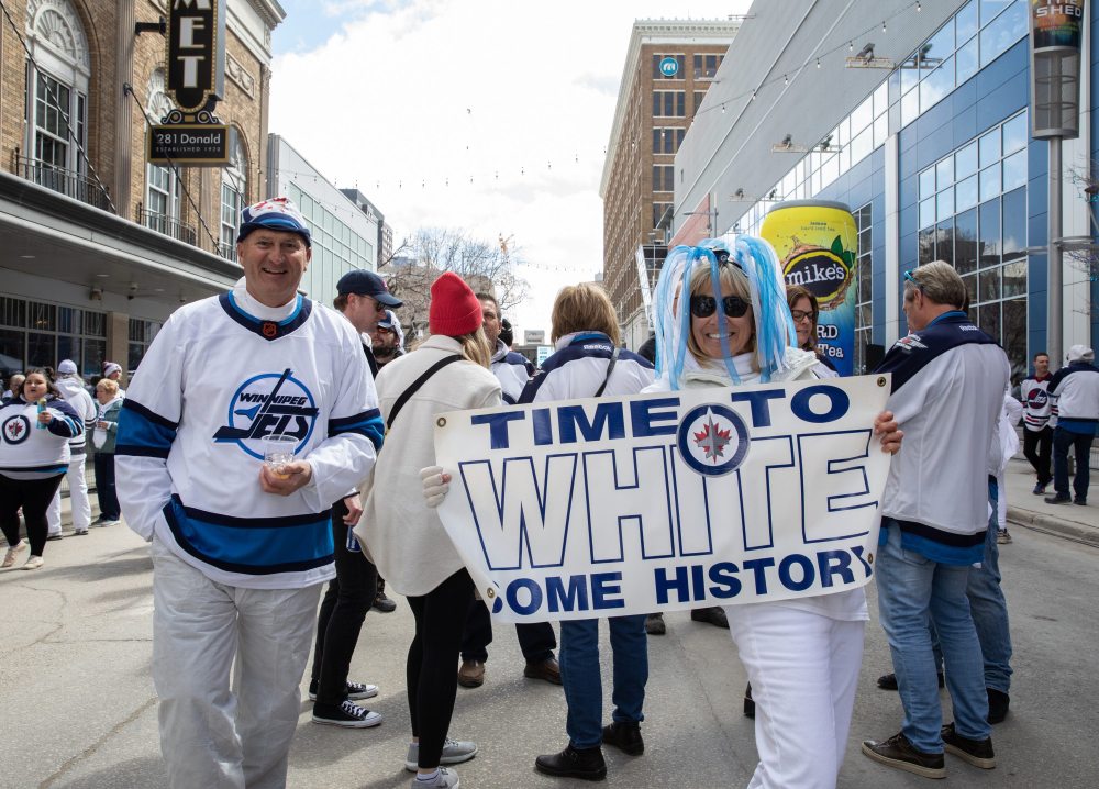 JESSICA LEE / WINNIPEG FREE PRESS
Lynne (right) and Michael Guertin are photographed at a Whiteout party. Thousands of Winnipeg Jets fans gathered downtown beside Canada Life Centre April 22, 2023 to watch the Jets play against the Golden Knights.