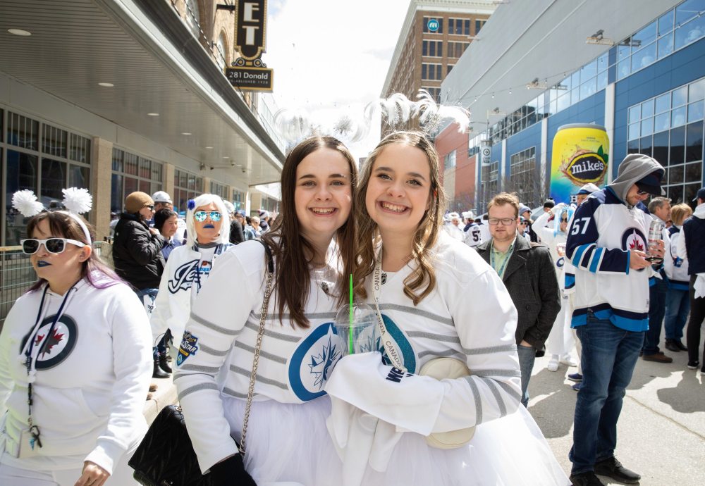 JESSICA LEE / WINNIPEG FREE PRESS
Twins Kelsey (right) and Lauren Rathwell are photographed at a Whiteout party. Thousands of Winnipeg Jets fans gathered downtown beside Canada Life Centre April 22, 2023 to watch the Jets play against the Golden Knights.
