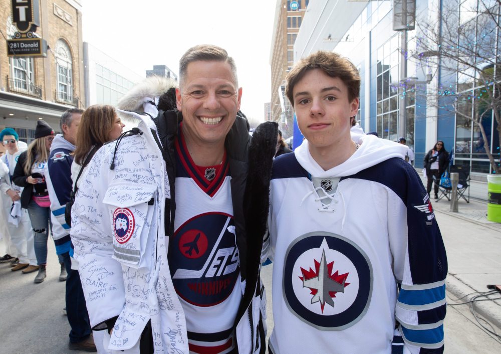 JESSICA LEE / WINNIPEG FREE PRESS
Former Winnipeg mayor Brian Bowman and his son Hayden are photographed at a Whiteout party. Thousands of Winnipeg Jets fans gathered downtown beside Canada Life Centre April 22, 2023 to watch the Jets play against the Golden Knights.