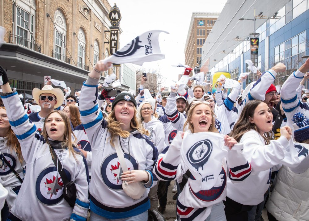 JESSICA LEE / WINNIPEG FREE PRESS
From left: Clara Sydor, Senna Laflamme, Breanna Dennis, and Nikki Slywchuk cheer for the Winnipeg Jets at a Whiteout party. Thousands of Winnipeg Jets fans gathered downtown beside Canada Life Centre April 22, 2023 to watch the Jets play against the Golden Knights at a Whiteout party.