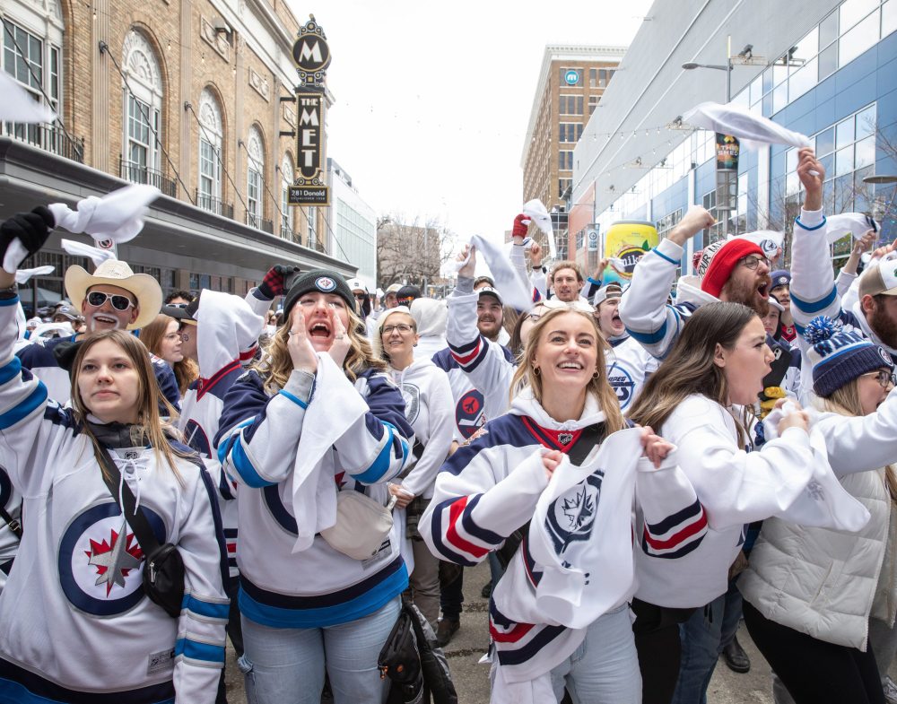 JESSICA LEE / WINNIPEG FREE PRESS
From left: Clara Sydor, Senna Laflamme, Breanna Dennis, and Nikki Slywchuk cheer for the Winnipeg Jets at a Whiteout party. Thousands of Winnipeg Jets fans gathered downtown beside Canada Life Centre April 22, 2023 to watch the Jets play against the Golden Knights at a Whiteout party.