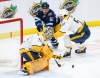 JOHN WOODS / THE CANADIAN PRESS
Nashville Predators goaltender Juuse Saros (74) saves the shot from Winnipeg Jets' Nino Niederreiter (62) as Dante Fabbro (57) defends during the first period NHL action in Winnipeg, Saturday, April 8, 2023.