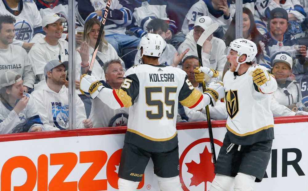 JOHN WOODS / THE CANADIAN PRESS
Vegas Golden KnightsÕ Keegan Kolesar (55) and Jack Eichel (9) celebrate after Kolesar scored against the Winnipeg Jets during the second period.