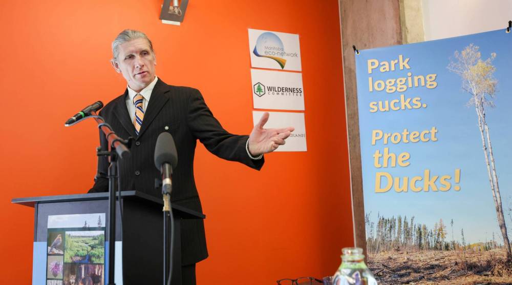 RUTH BONNEVILLE / WINNIPEG FREE PRESS 
                                Eric Reder, a campaign leader for the Manitoba Wilderness Committee, explains that a decline in safe habitat caused by commercial forestry leaves moose vulnerable to predators like wolves.