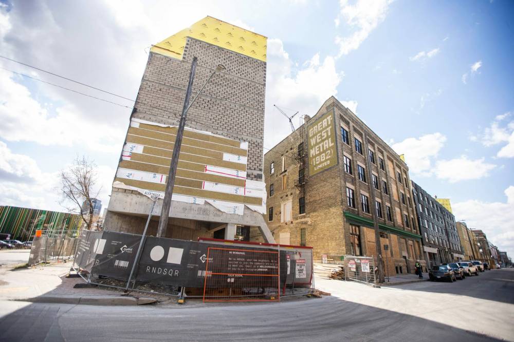 MIKAELA MACKENZIE / WINNIPEG FREE PRESS
The former Great West Metal Co. building at 90 Alexander Ave. in the East Exchange District is being redeveloped in a project called The Bend, with a new structure wrapping around the heritage building.