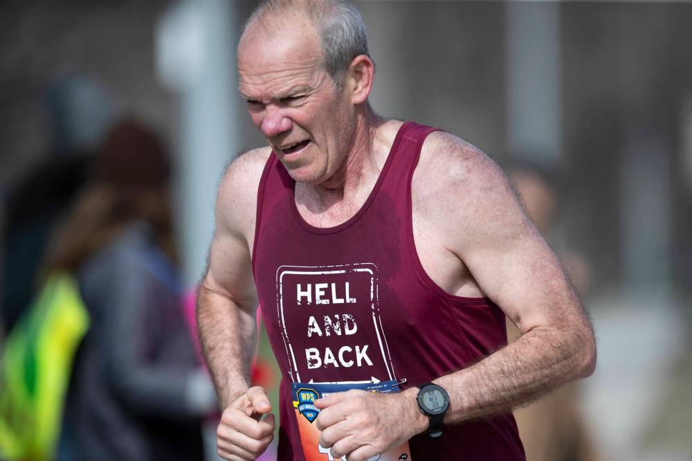 BROOK JONES / WINNIPEG FREE PRESS
                                Bob Cox maintains a steady pace during the marathon. Upwards of 1,600 people signed up for the annual running event.