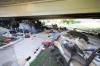 RUTH BONNEVILLE / WINNIPEG FREE PRESS FILES
                                A homeless encampment under the Maryland Street bridge in 2021. With homelessness a growing problem in the city, advocates are making non-profit housing a provincial election issue.