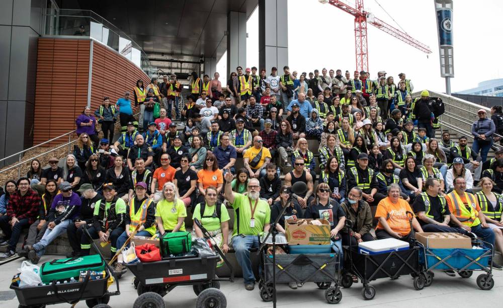 JESSICA LEE / WINNIPEG FREE PRESS
Community patrol groups assembled together at True North Square on Saturday. The day was, in part, meant to connect the various groups. The volunteers mingled and heard speeches from various politicians before walking through downtown.