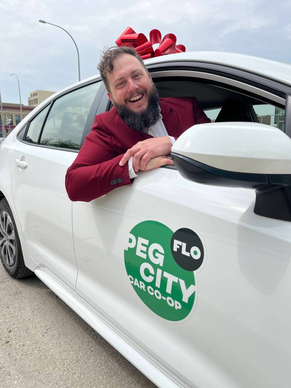 GABRIELLE PICHE / WINNIPEG FREE PRESS
Philip Mikulec, Peg City chief executive officer, with one of 35 Toyota Corollas set set to join the program.