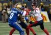 ETHAN CAIRNS / WINNIPEG FREE PRESS FILES
                                Winnipeg Blue Bombers’ Malik Clements (0) attempts to tackle Montreal Alouettes’ quarterback Trevor Harris (7) in the second half of their CFL game in Winnipeg in 2022.