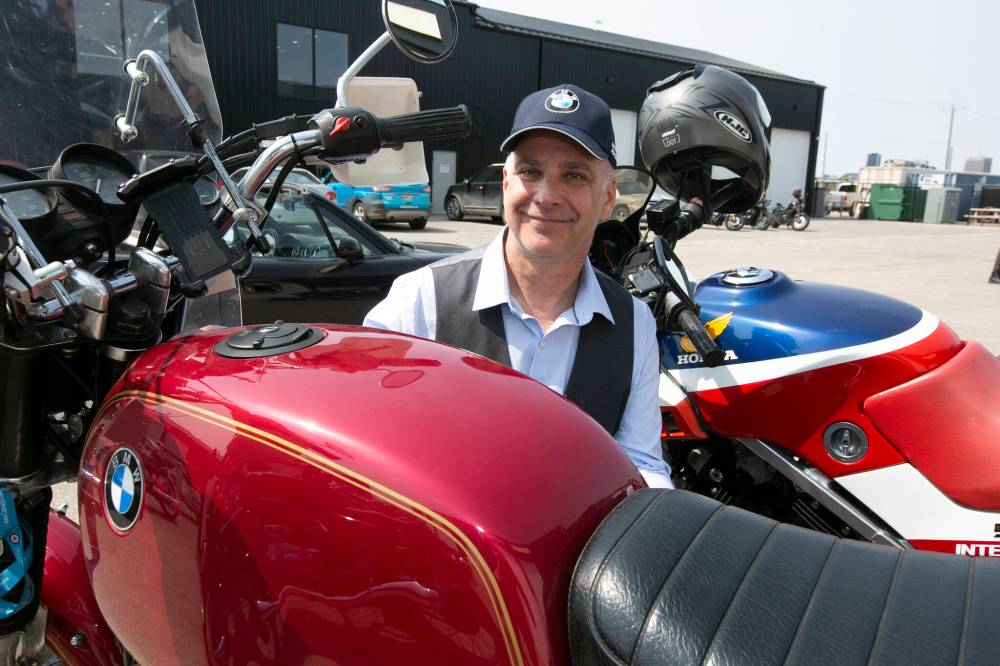 BROOK JONES / WINNIPEG FREE PRESS
Winnipeg resident Craig Sweet, 53, checks out his 1980 BMW R100T before the start of the ride. His father, Charles, 82, drove the motorcycle from Nova Scotia to Winnipeg to give it to him as a gift.