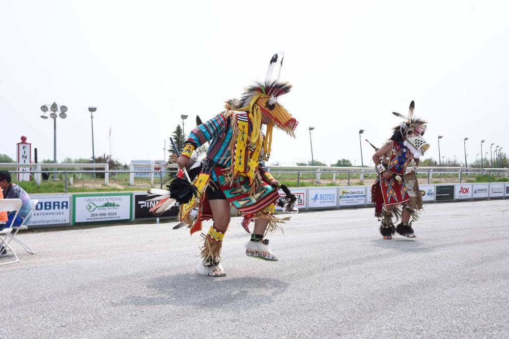 MIKE SUDOMA / WINNIPEG FREE PRESS
Horse dancers entertain the crowd before the first heat at the Indian Horse Relay.