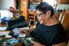 MIKAELA MACKENZIE / WINNIPEG FREE PRESS
                                Janet Bruyere, grandmother of Fonassa Bruyere, looks at old photos of Fonassa in her home on Sagkeeng First Nation.