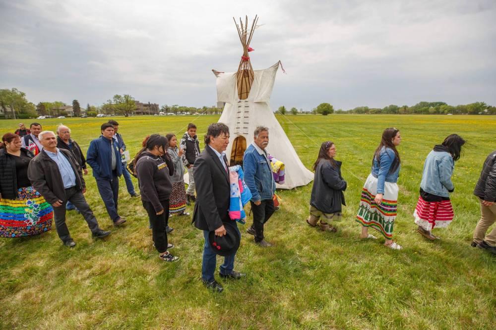 Mike Deal / Winnipeg Free Press Files
Leaders and dancers at the ceremony with the Retreat of Eagle Staff Flags during the Treaty One Nation Land Reclamation Ceremony for the Naawi-Oodena Treaty One Jointly Held lands, on the former Kapyong Barracks lands in Winnipeg.