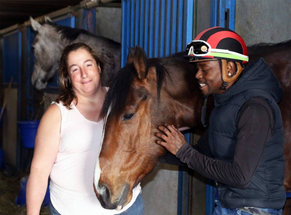 George Williams / Winnipeg Free Press
Trainer Lise Pruitt and jockey Antonio Whitehall with Crowned Royal, one of the horses that helped them both score hat tricks Tuesday night at Assiniboia Downs.
