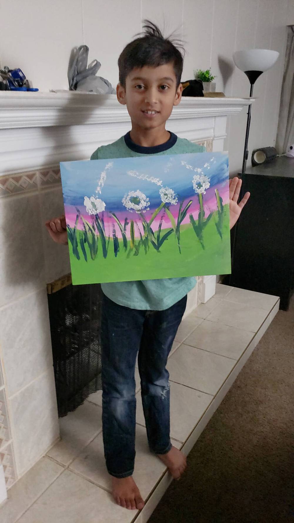 Canstar Community News Usaid Habib with the painting of dandelions that he made during a virtual paint night hosted by the Manitoba Islamic Association.