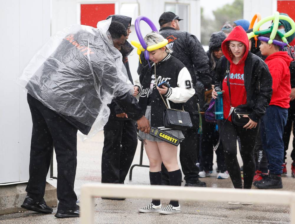 JOHN WOODS / WINNIPEG FREE PRESS FILES
                                Security personnel search people as they enter the Red River Exhibition on June 21, 2022 after a brazen shooting that sent two boys to hospital and fair-goers running for cover.