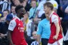 Arsenal's Martin Odegaard, right, celebrates with Bukayo Saka after scoring the opening goal during an English Premier League soccer match between Newcastle and Arsenal at St James' Park stadium in Newcastle, Sunday, May 7, 2023. (AP Photo/Jon Super)