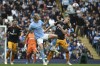 Leeds United's Rasmus Kristensen, right, and Manchester City's Erling Haaland battle for the ball during the English Premier League soccer match between Manchester City and Leeds United at Etihad stadium in Manchester, England, Saturday, May 6, 2023. (AP Photo/Rui Vieira)