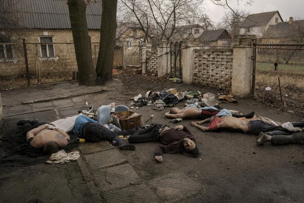 Bodies of men, some with their hands tied behind their backs, lie on the ground in Bucha, Ukraine, April 3, 2022. The image was part of a series of images by Associated Press photographers that was awarded the 2023 Pulitzer Prize for Breaking News Photography. (AP Photo/Vadim Ghirda)