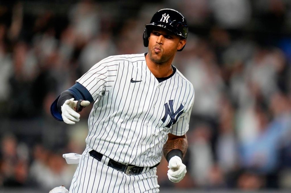 New York Yankees' Aaron Hicks gestures to teammates as he runs the bases after hitting a two-run home run during the seventh inning of a baseball game against the Oakland Athletics, Monday, May 8, 2023, in New York. (AP Photo/Frank Franklin II)