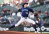 Seattle Mariners starting pitcher Logan Gilbert throws against the Texas Rangers during the first inning of a baseball game Monday, May 8, 2023, in Seattle. (AP Photo/Lindsey Wasson)