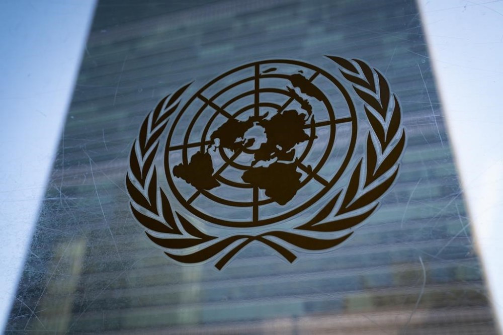 FILE - The symbol of the United Nations is displayed outside the Secretariat Building, Feb. 28, 2022, at United Nations Headquarters. (AP Photo/John Minchillo, File)