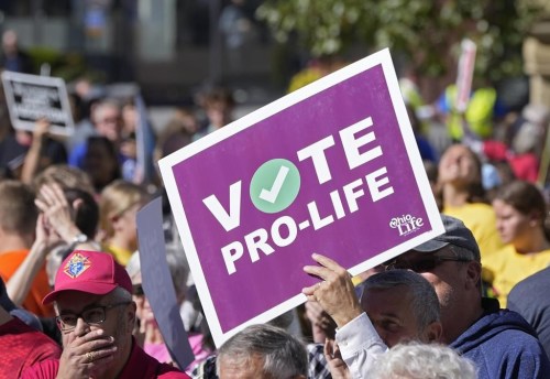 FILE - Demonstrators turn out for 