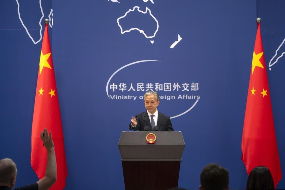 Chinese Foreign Ministry spokesperson Wang Wenbin gestures during a regular press conference in Beijing, Tuesday, May 9, 2023. China announced the expulsion of a Canadian diplomat on Tuesday in retaliation for Ottawa ordering a Chinese consular official to leave the country over alleged threats he made against a Canadian lawmaker and his family. (AP Photo/Mark Schiefelbein)