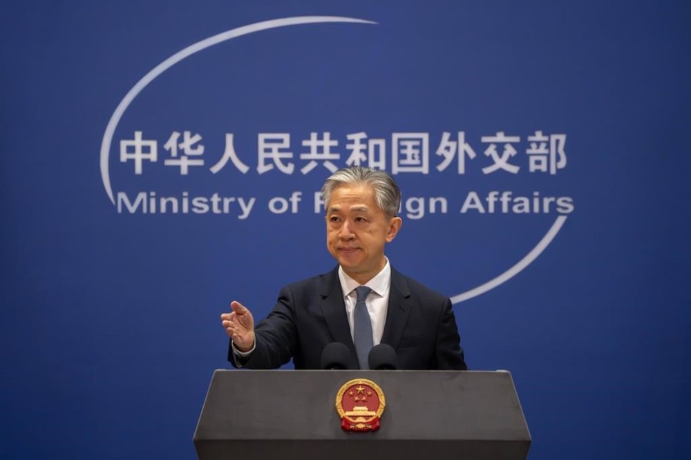 Chinese Foreign Ministry spokesperson Wang Wenbin gestures during a regular press conference in Beijing, Tuesday, May 9, 2023. China announced the expulsion of a Canadian diplomat on Tuesday in retaliation for Ottawa ordering a Chinese consular official to leave the country over alleged threats he made against a Canadian lawmaker and his family. (AP Photo/Mark Schiefelbein) ///