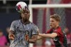 CF Montreal's Chinonso Offor (left) shields the ball from Toronto FC's Sigurd Rosted during first half Canadian Championship quarterfinal action in Toronto on Tuesday, May 9, 2023.THE CANADIAN PRESS/Chris Young