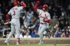 St. Louis Cardinals' Paul DeJong, right, celebrates his home run with Dylan Carlson during the ninth inning of a baseball game against the Chicago Cubs Tuesday, May 9, 2023, in Chicago. (AP Photo/Erin Hooley)