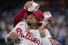 Philadelphia Phillies' Nick Castellanos is doused by Bryson Stott after a baseball game against the Toronto Blue Jays, Tuesday, May 9, 2023, in Philadelphia. (AP Photo/Matt Slocum)
