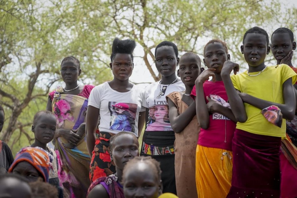 Residents gather in Wunlueth village in Canal-Pigi county, South Sudan Thursday, May 4, 2023. More than 40,000 people, mostly South Sudanese, have crossed the border into South Sudan since Sudan erupted in conflict nearly one month ago, yet many are returning to areas unable to support them and still riddled by fighting. (AP Photo/Sam Mednick)