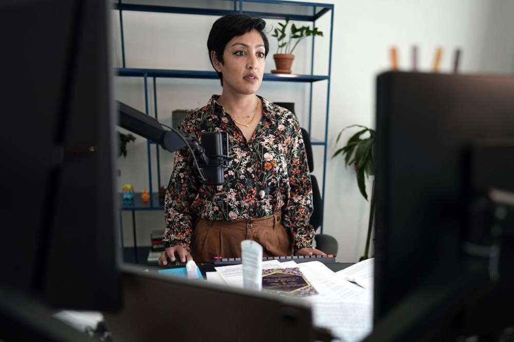 Rumman Chowdhury, co-founder of Humane Intelligence, a nonprofit developing accountable AI systems, works at her computer Monday, May 8, 2023, in Katy, Texas. ChatGPT maker OpenAI, and other major AI providers such as Google and Microsoft, are coordinating with the Biden administration to let thousands of hackers take a shot at testing the limits of their technology. Chowdhury is the lead coordinator of the mass hacking event planned for this summer's DEF CON hacker convention in Las Vegas. (AP Photo/David J. Phillip)