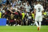 Manchester City's Kevin De Bruyne celebrates with teammates after scoring his side's opening goal during the Champions League semifinal first leg soccer match between Real Madrid and Manchester City at the Santiago Bernabeu stadium in Madrid, Spain, Tuesday, May 9, 2023. (AP Photo/Jose Breton)