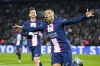 PSG's Kylian Mbappe celebrates scoring his side's opening goal during the French League One soccer match between Paris Saint Germain and Lens at Parc des Princes stadium in Paris, France, Saturday, April 15, 2023. (AP Photo/Michel Euler)