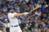 Chicago Cubs' Patrick Wisdom watches his two-run home run off St. Louis Cardinals starting pitcher Jordan Montgomery during the third inning of a baseball game Wednesday, May 10, 2023, in Chicago. (AP Photo/Charles Rex Arbogast)