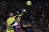 FILE - Betis' goalkeeper Rui Silva, left, clears the ball in front Barcelona's Robert Lewandowski during a Spanish La Liga soccer match between Barcelona and Real Betis at the Camp Nou stadium in Barcelona, Spain, on April 29, 2023. With the Spanish league title nearly in its grasp, Barcelona can finally start moving past the exit of Lionel Messi three years ago. The Catalan club only needs 2 of the remaining 15 points in play to win its first domestic league since 2019. It will get its first chance at clinching the title on Sunday May 14, 2023 when it visits Espanyol. (AP Photo/Joan Monfort, File)