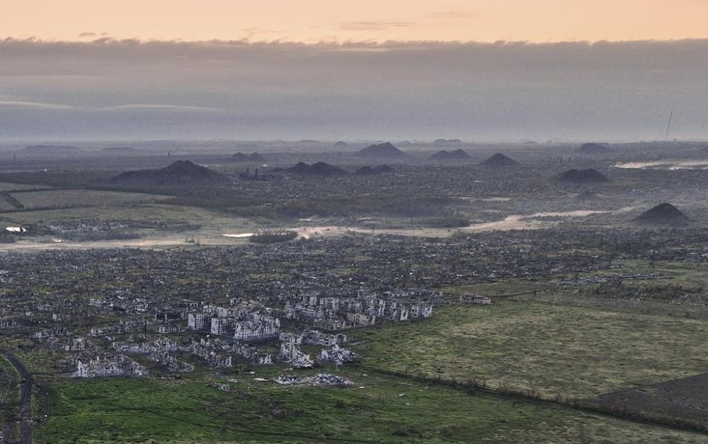 Residential buildings razed to the ground, coal waste heaps, and shell craters are seen on an aerial view of Maryinka, an eastern city where heaviest battles with the Russian troops have been taking place in the Donetsk region, Ukraine, Thursday, May 11, 2023. (AP Photo/Libkos)