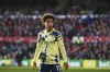 FILE - Leeds United's Tyler Adams stands on the pitch during their English Premier League soccer match against Nottingham Forest at City Ground stadium in Nottingham, England, on Feb. 5, 2023. United States captain Tyler Adams is unlikely to play again for Leeds this season. Adams underwent hamstring surgery in March and Leeds manager Sam Allardyce says on Thursday, May 11 he does not expect the defensive midfielder to feature in the team’s final three games as it battles to avoid relegation from the Premier League. (AP Photo/Rui Vieira, File)