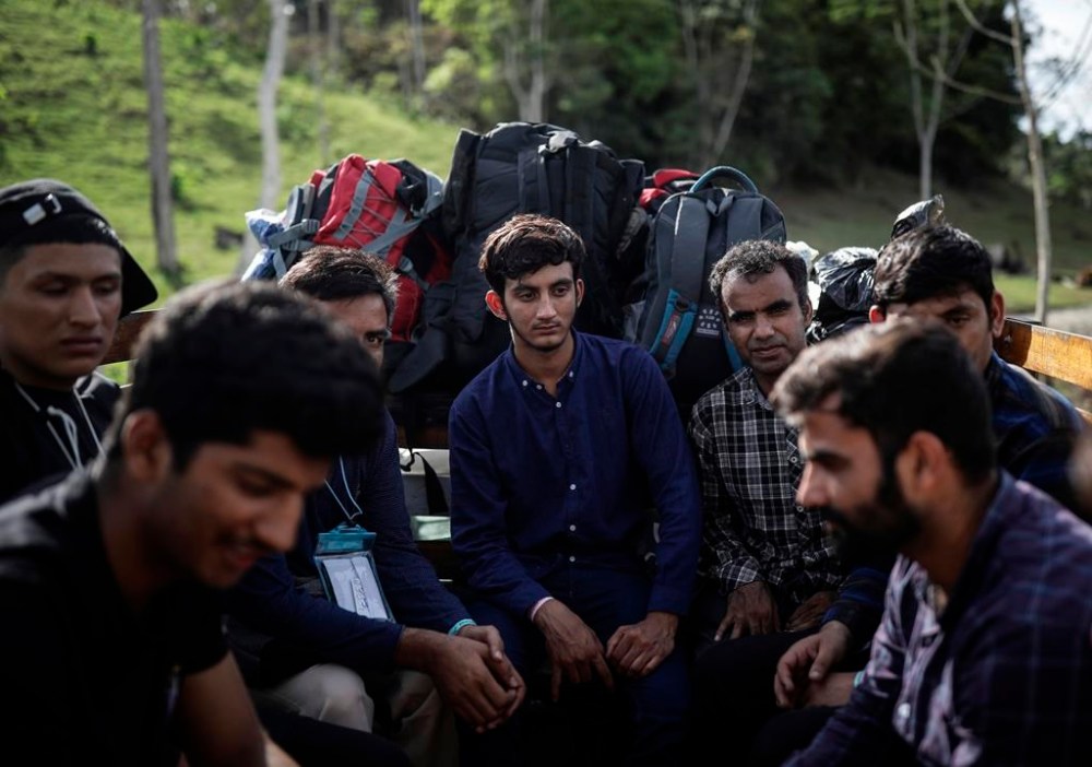 Migrants from Pakistan arrive to the Las Tecas trail head for crossing of the Darien Gap from Acandi, Colombia into Panama, in hopes of reaching the U.S., May 10, 2023. Pandemic-related U.S. asylum restrictions, known as Title 42, are to expire Thursday, May 11. (AP Photo/Ivan Valencia)