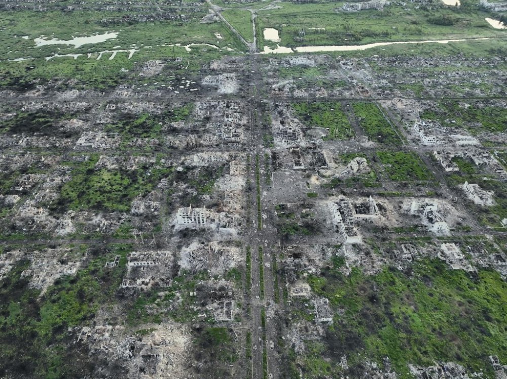 Residential buildings razed to the ground and shell craters are seen on an aerial view of Maryinka, an eastern city where heaviest battles with the Russian troops have been taking place in the Donetsk region, Ukraine, Thursday, May 11, 2023. (AP Photo/Libkos)