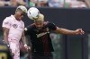 Inter Miami midfielder Emerson Rodriguez, left, and Atlanta United defender George Campbell head the ball, Sunday, April 24, 2022, during the second half of an MLS soccer match in Fort Lauderdale, Fla. THE CANADIAN PRESS/AP-Wilfredo Lee