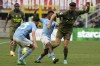 AC Milan's Olivier Giroud, right, challenges for the ball with Lazio's Marcos Antonio during a Serie A soccer match between AC Milan and Lazio, at the San Siro stadium in Milan, Italy, Saturday, May 6, 2023. (AP Photo/Luca Bruno)