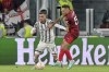 Juventus' Filip Kostic, left, and Sevilla's Lucas Ocampos battle for the ball during the Europa League soccer match between Juventus and Sevilla at Allianz Stadium in Turin, Italy, Thursday May 11, 2023. (Tano Pecoraro/LaPresse via AP)