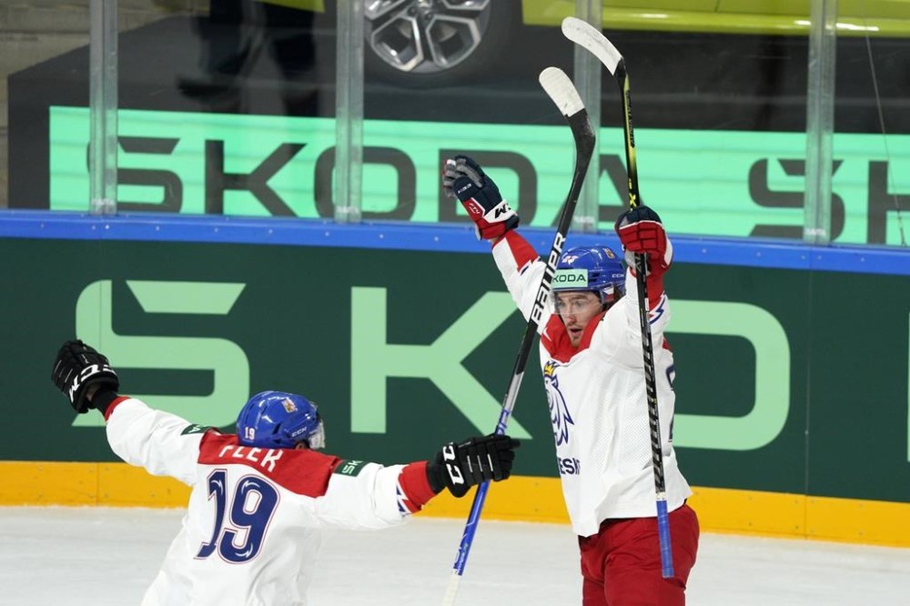 Lukas Sedlak, right, and Jakub Flek of Czech Republic celebrate a goal during the group B match between Slovakia and the Czech Republic at the ice hockey world championship in Riga, Latvia, Friday, May 12, 2023. (AP Photo/Roman Koksarov)