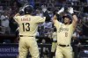 Arizona Diamondbacks' Dominic Fletcher (8) celebrates with teammate Nick Ahmed (13) after hitting a three-run home run against the San Francisco Giants in the second inning during a baseball game, Friday, May 12, 2023, in Phoenix. (AP Photo/Rick Scuteri)